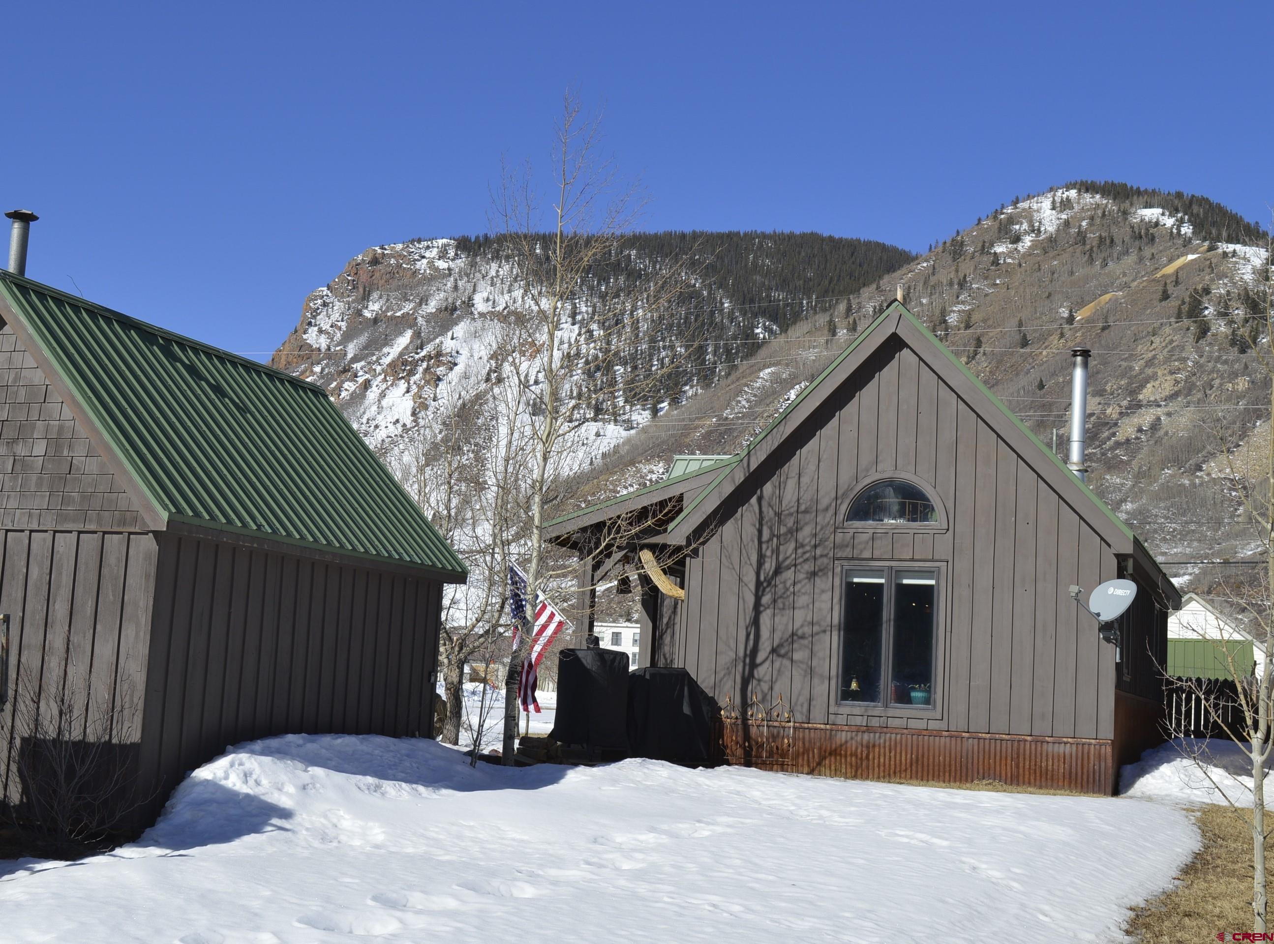 1505 Cement Street Silverton, CO 81433 - Photo 20 of 21 a view of a house with a snow in the background