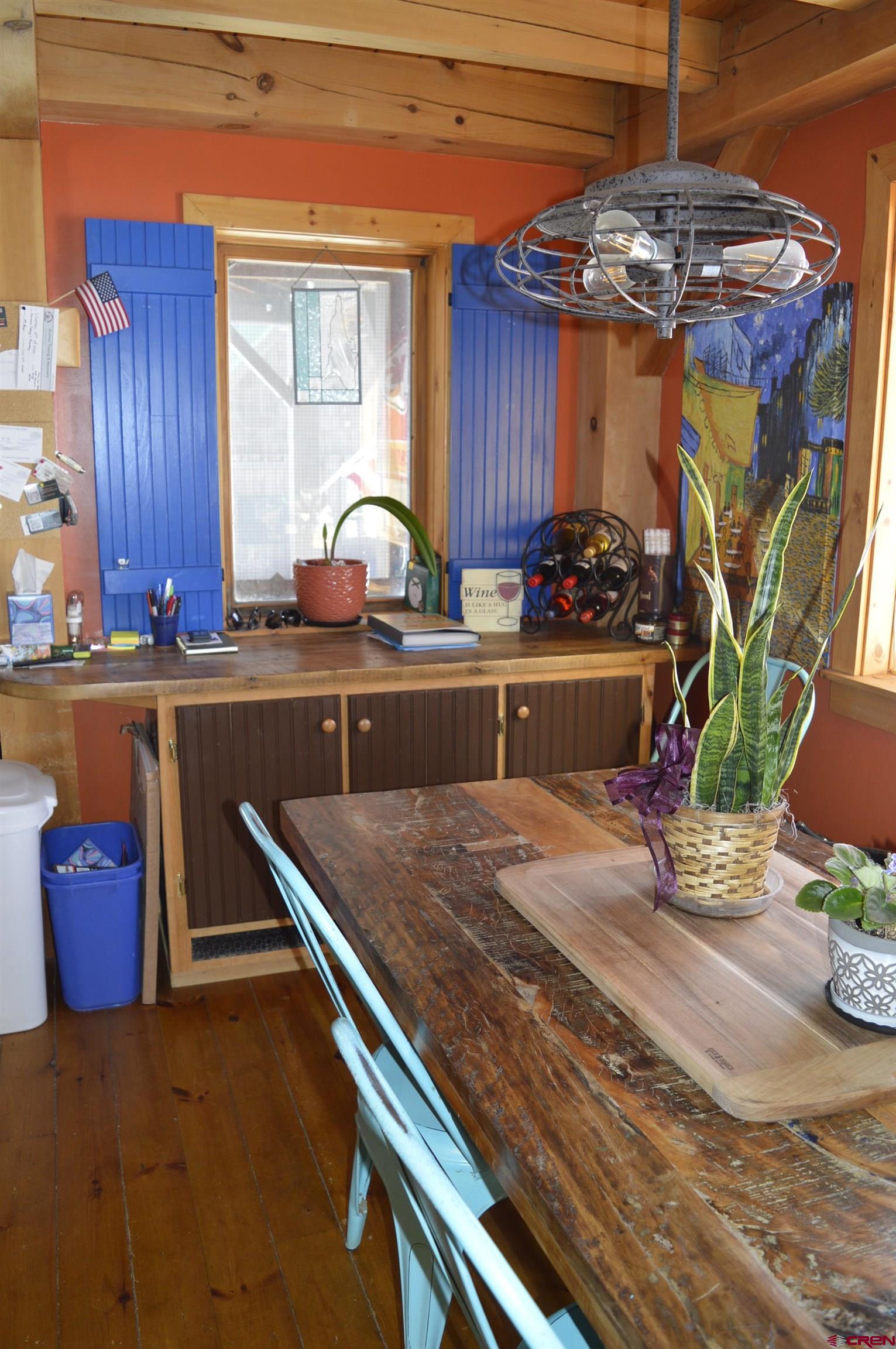 1505 Cement Street Silverton, CO 81433 - Photo 6 of 21 a kitchen with stainless steel appliances granite countertop a sink dishwasher and cabinets with wooden floor