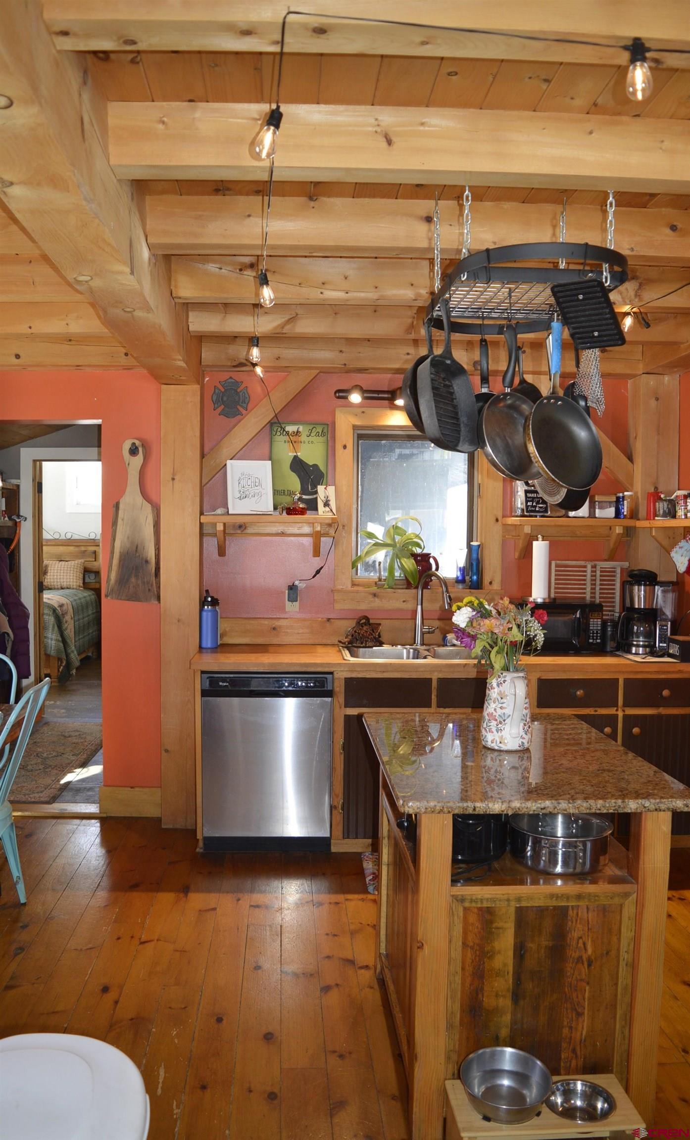 1505 Cement Street Silverton, CO 81433 - Photo 8 of 21 a kitchen with stainless steel appliances granite countertop a sink and a stove