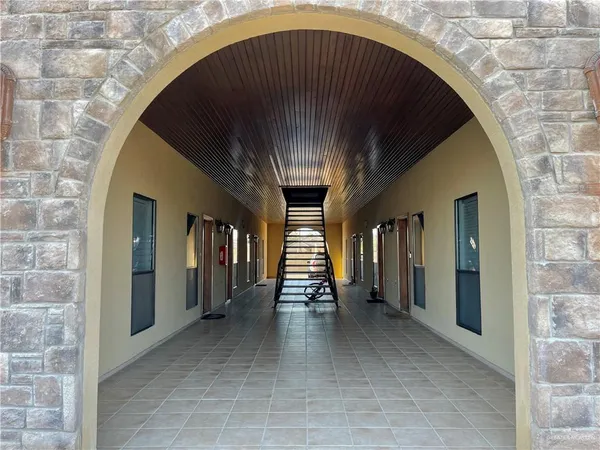 a view of gallery with car parked