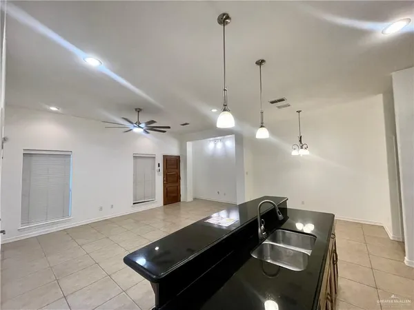a lobby with furniture and a chandelier