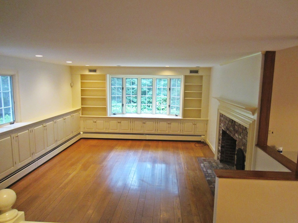 10 Ordway Road Wellesley, MA 02481 - Photo 15 of 20 a view of an empty room with a fireplace and a window