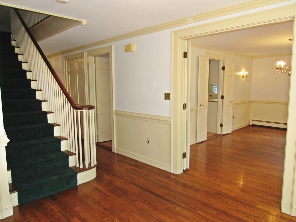 10 Ordway Road Wellesley, MA 02481 - Photo 8 of 20 a view of a hallway with wooden floor and entryway
