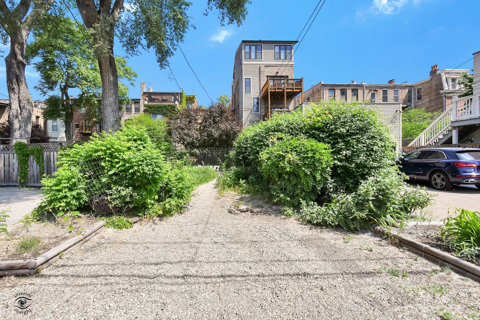 1515 West Jackson Boulevard Chicago, IL 60607 - Photo 16 of 21 a view of a street with potted plants and large trees