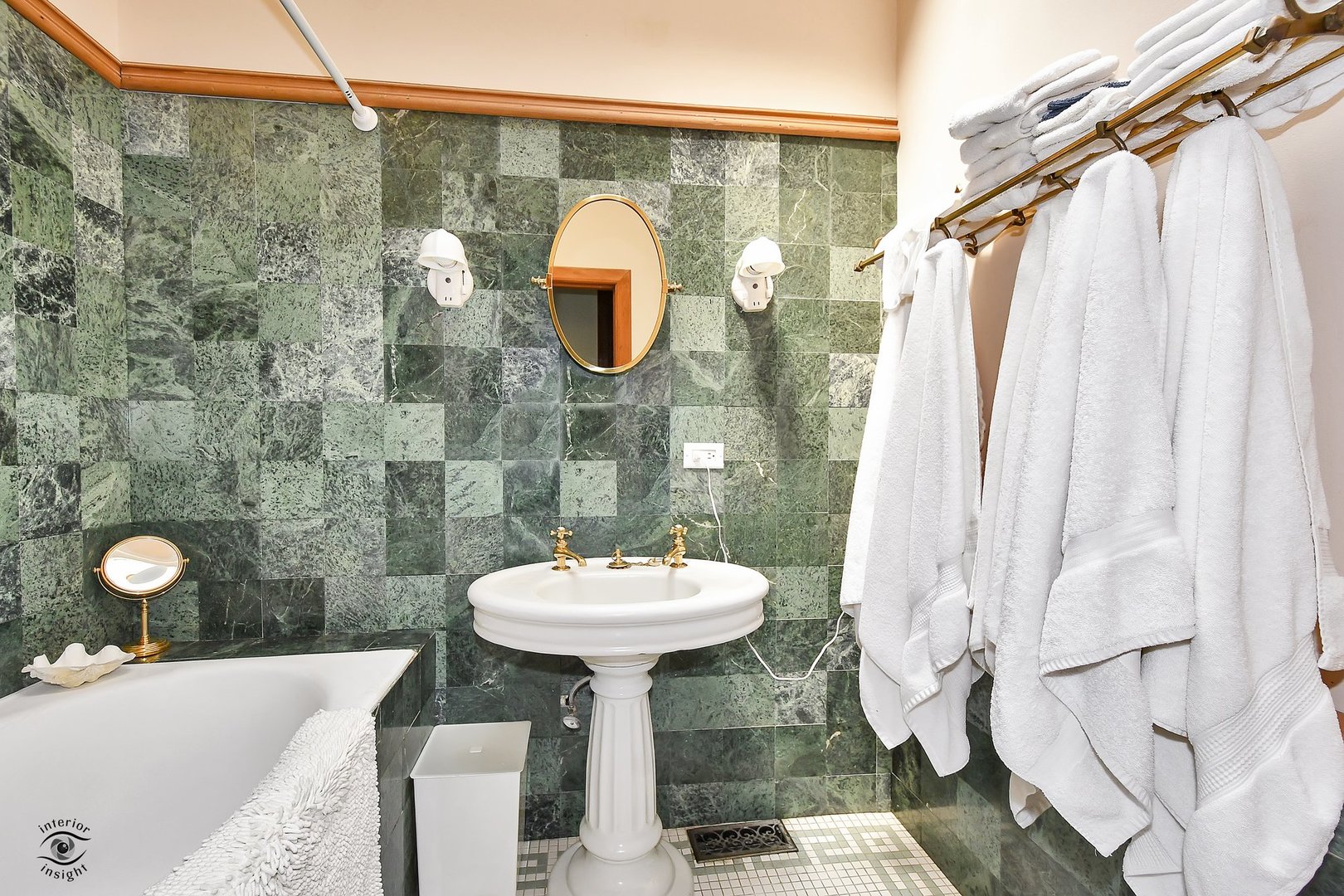1515 West Jackson Boulevard Chicago, IL 60607 - Photo 17 of 21 a bathroom with a sink a mirror and shower