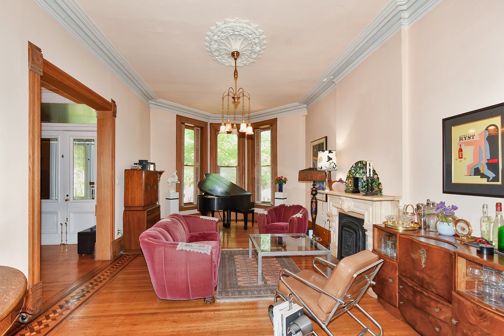 1515 West Jackson Boulevard Chicago, IL 60607 - Photo 4 of 21 a living room with furniture a chandelier and wooden floor