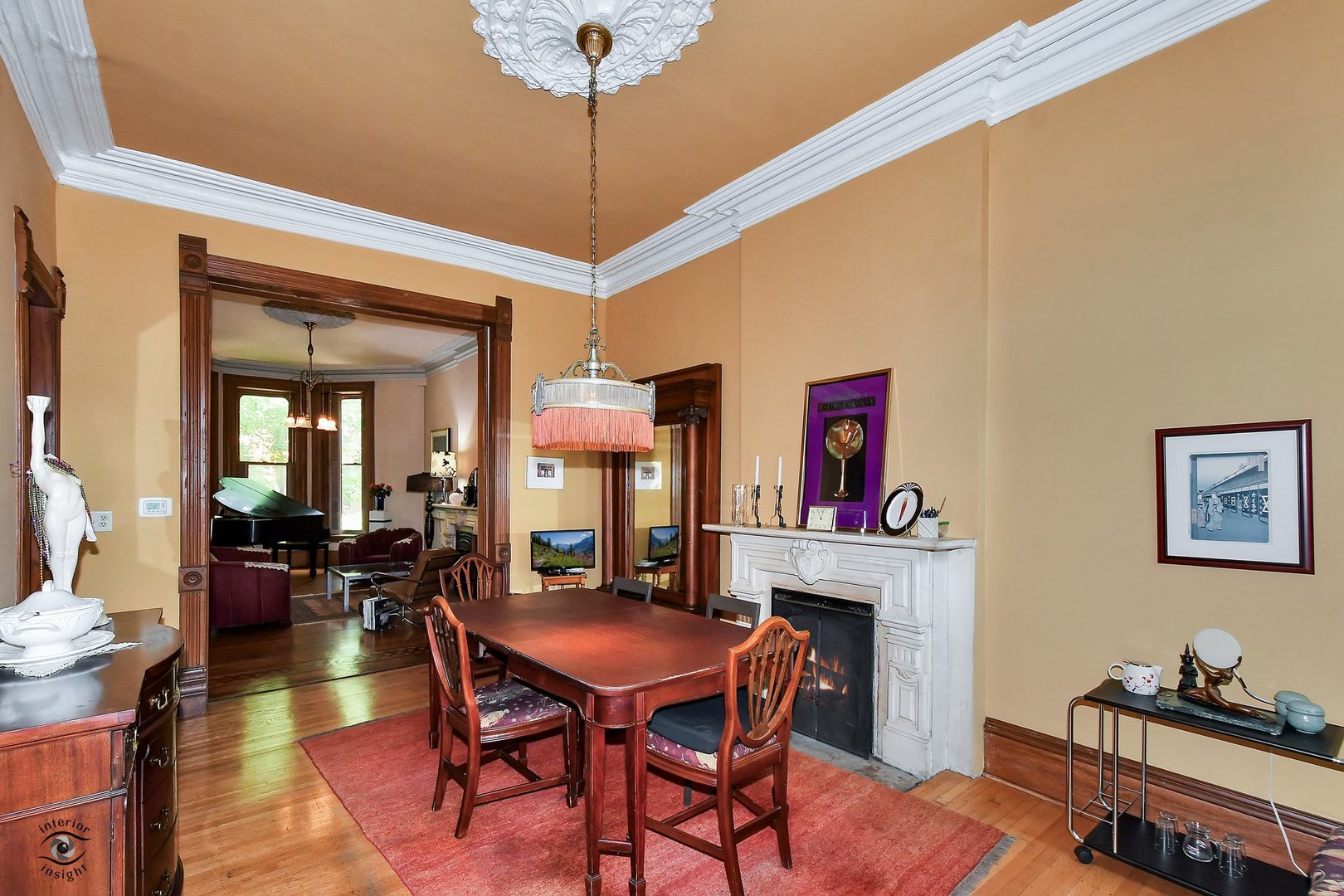 1515 West Jackson Boulevard Chicago, IL 60607 - Photo 5 of 21 a dining room with furniture a chandelier and wooden floor