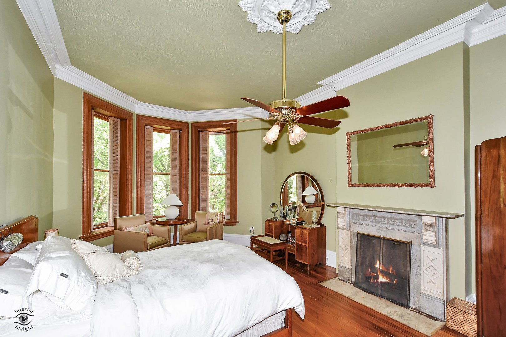 1515 West Jackson Boulevard Chicago, IL 60607 - Photo 6 of 21 a bedroom with a bed and a fireplace