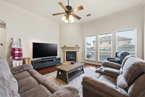 a living room with furniture and a fireplace