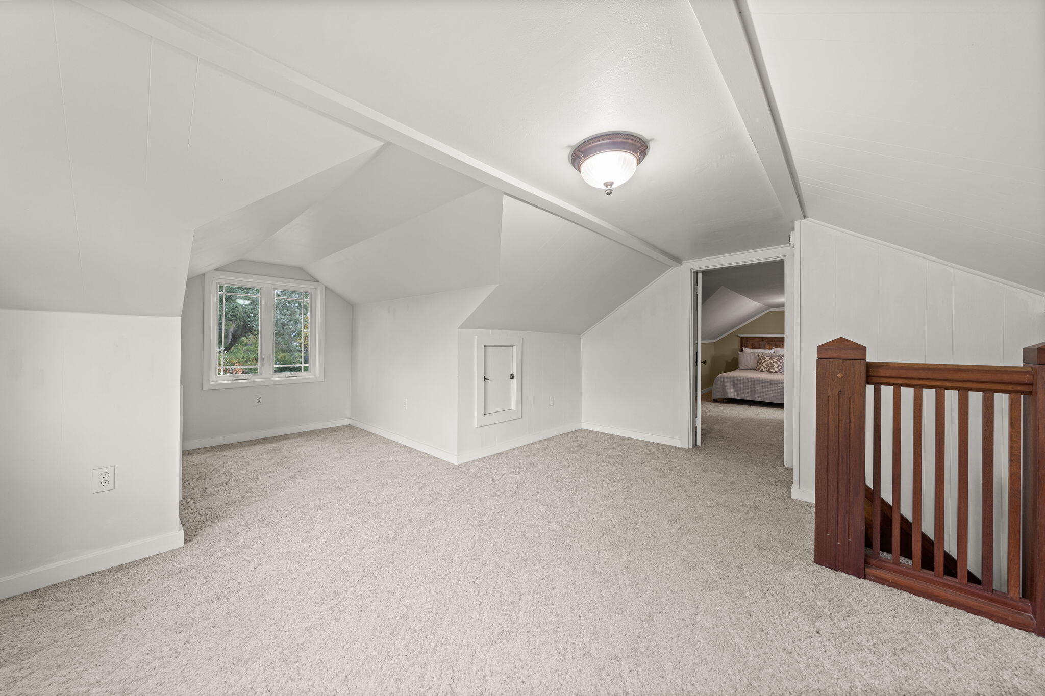 21925 Bear Creek Road Bend, OR 97702 - Photo 53 of 104 Second Level Bonus Room was used as an office, sewing room w/guest bed. Lots of light and dormer. Door into Bedroom #4 w/half bath