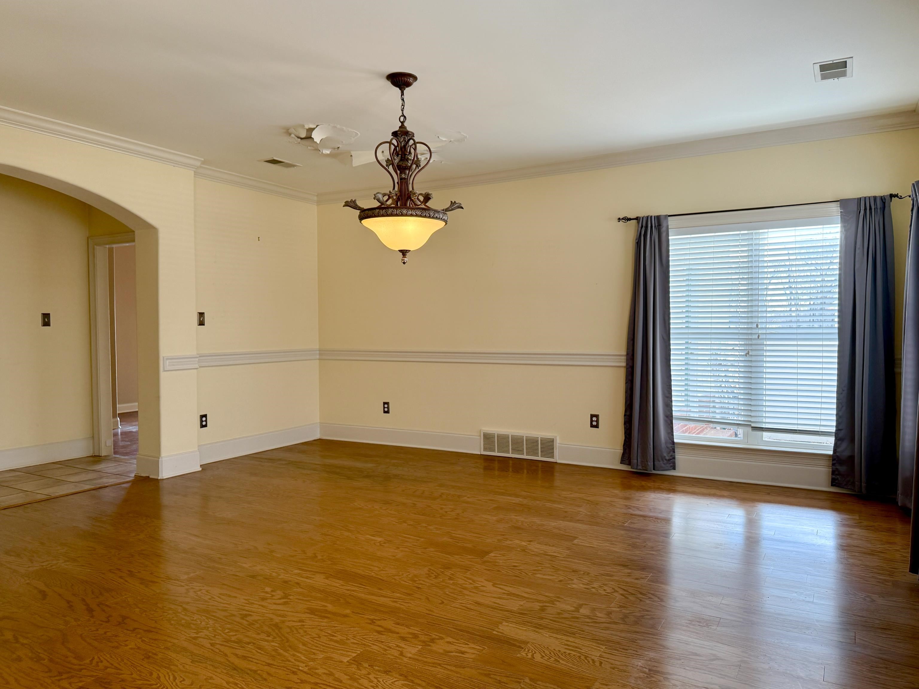 200 Diffee Road Moscow, TN 38057 - Photo 15 of 33 Spare room featuring crown molding and hardwood / wood-style floors