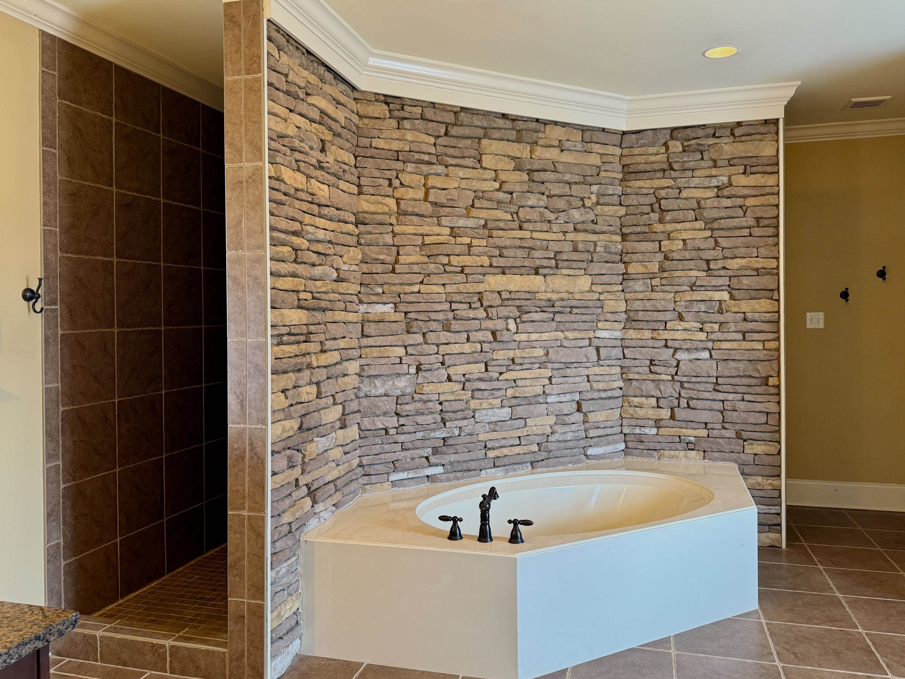 200 Diffee Road Moscow, TN 38057 - Photo 23 of 33 Bathroom featuring tile patterned flooring, crown molding, and independent shower and bath