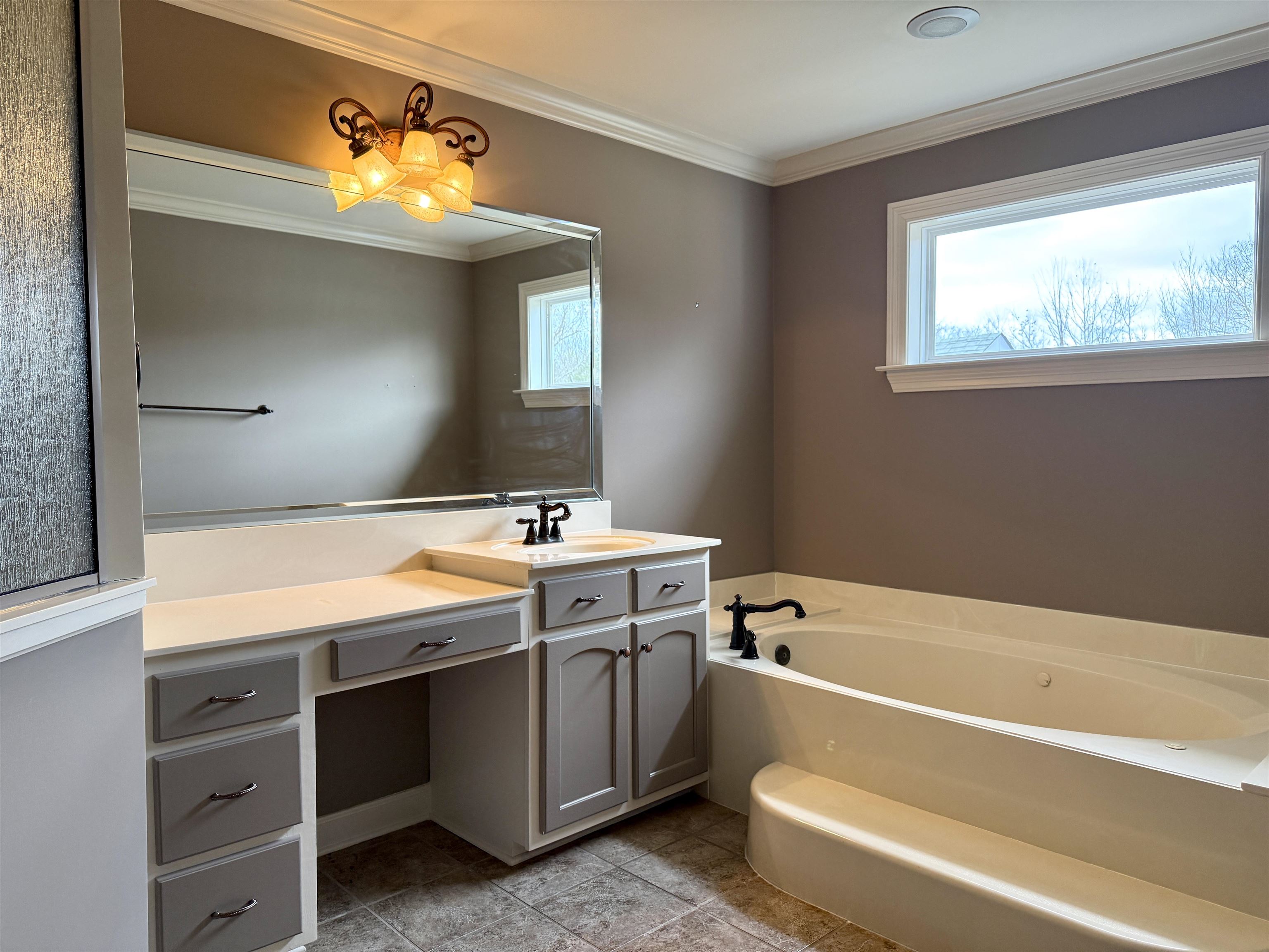 200 Diffee Road Moscow, TN 38057 - Photo 26 of 33 Bathroom featuring crown molding, a washtub, and vanity