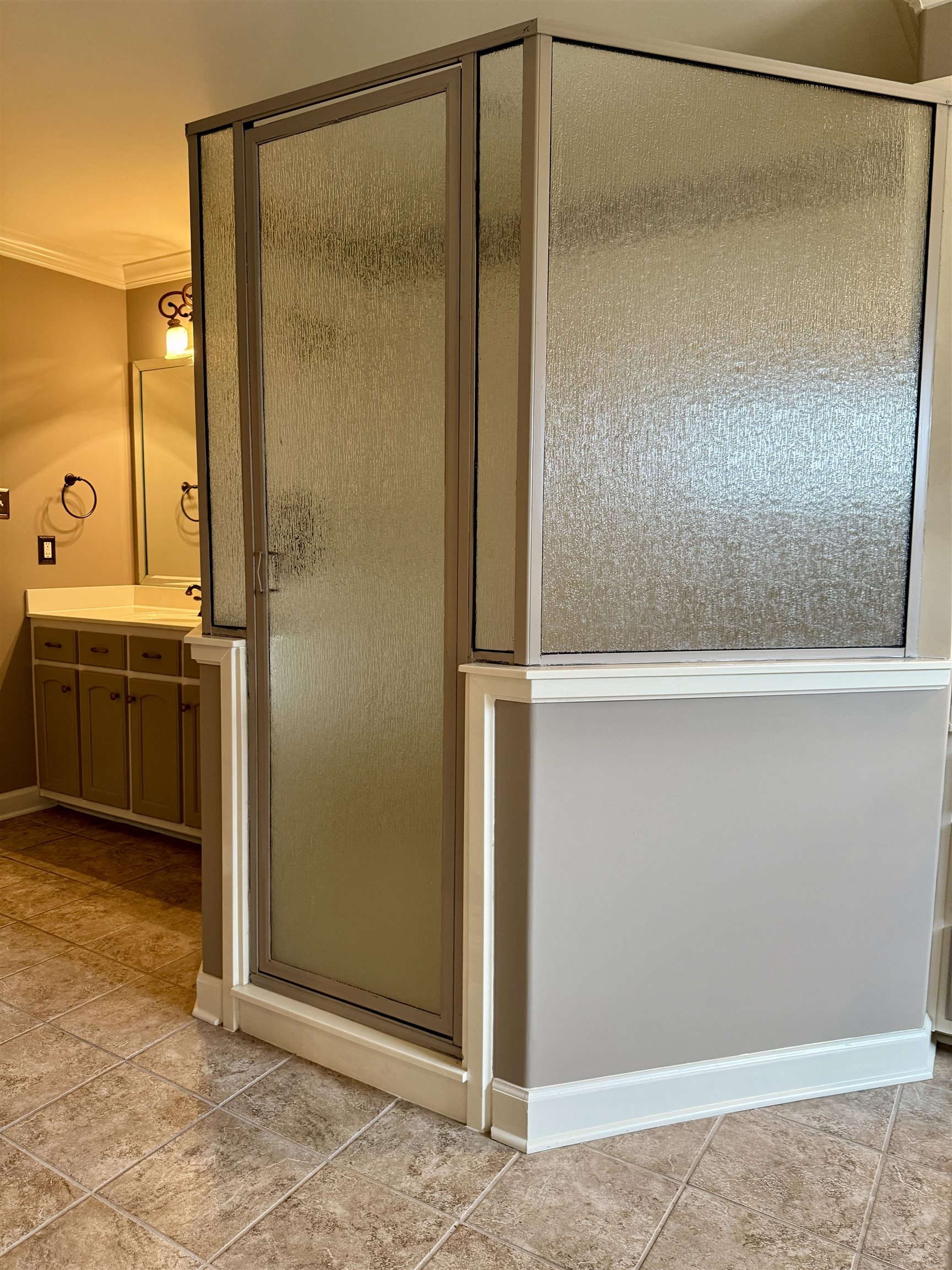 200 Diffee Road Moscow, TN 38057 - Photo 27 of 33 Bathroom with ornamental molding, vanity, tile patterned floors, and walk in shower
