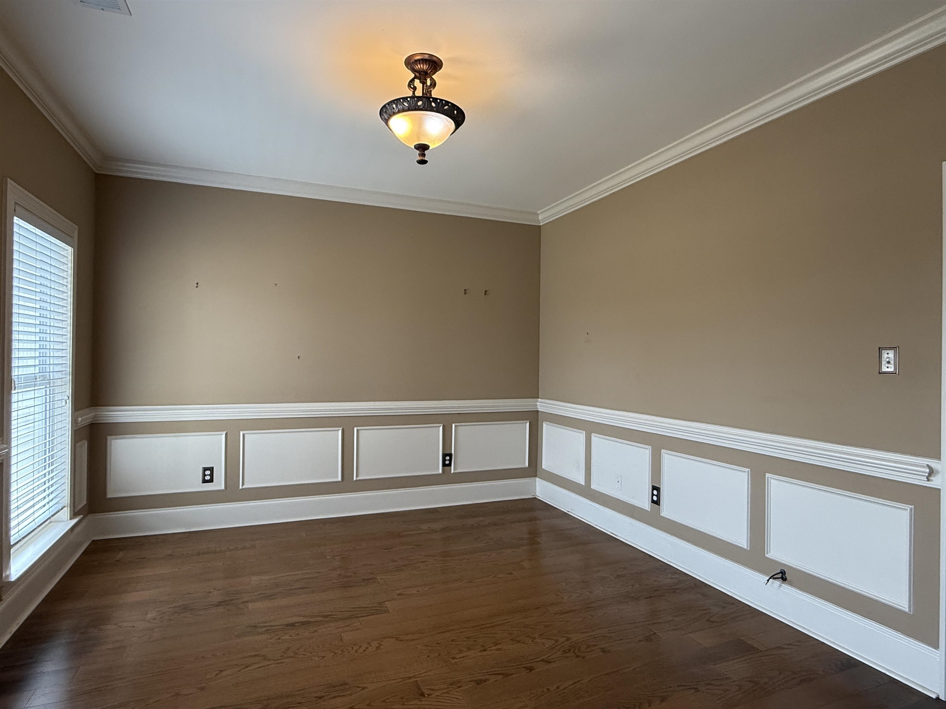 200 Diffee Road Moscow, TN 38057 - Photo 9 of 33 Unfurnished room featuring dark hardwood / wood-style flooring and crown molding