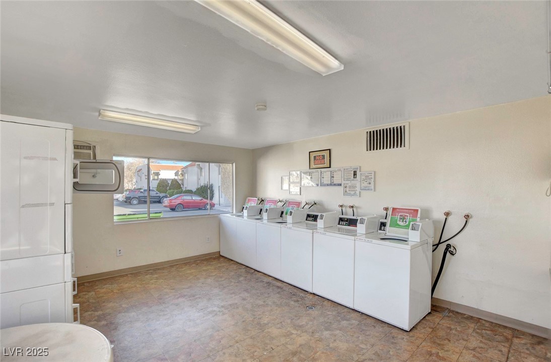 870 B, Unit 506 Boulder City, NV 89005 - Photo 33 of 33 Community laundry room with independent washer and dryer and a wall mounted air conditioner