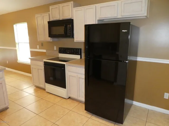 a view of a bathroom from a hallway