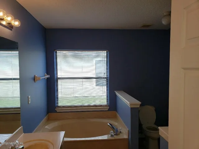a bathroom with a sink double vanity and a mirror