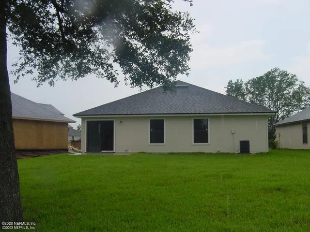 a view of a backyard with a small cabin