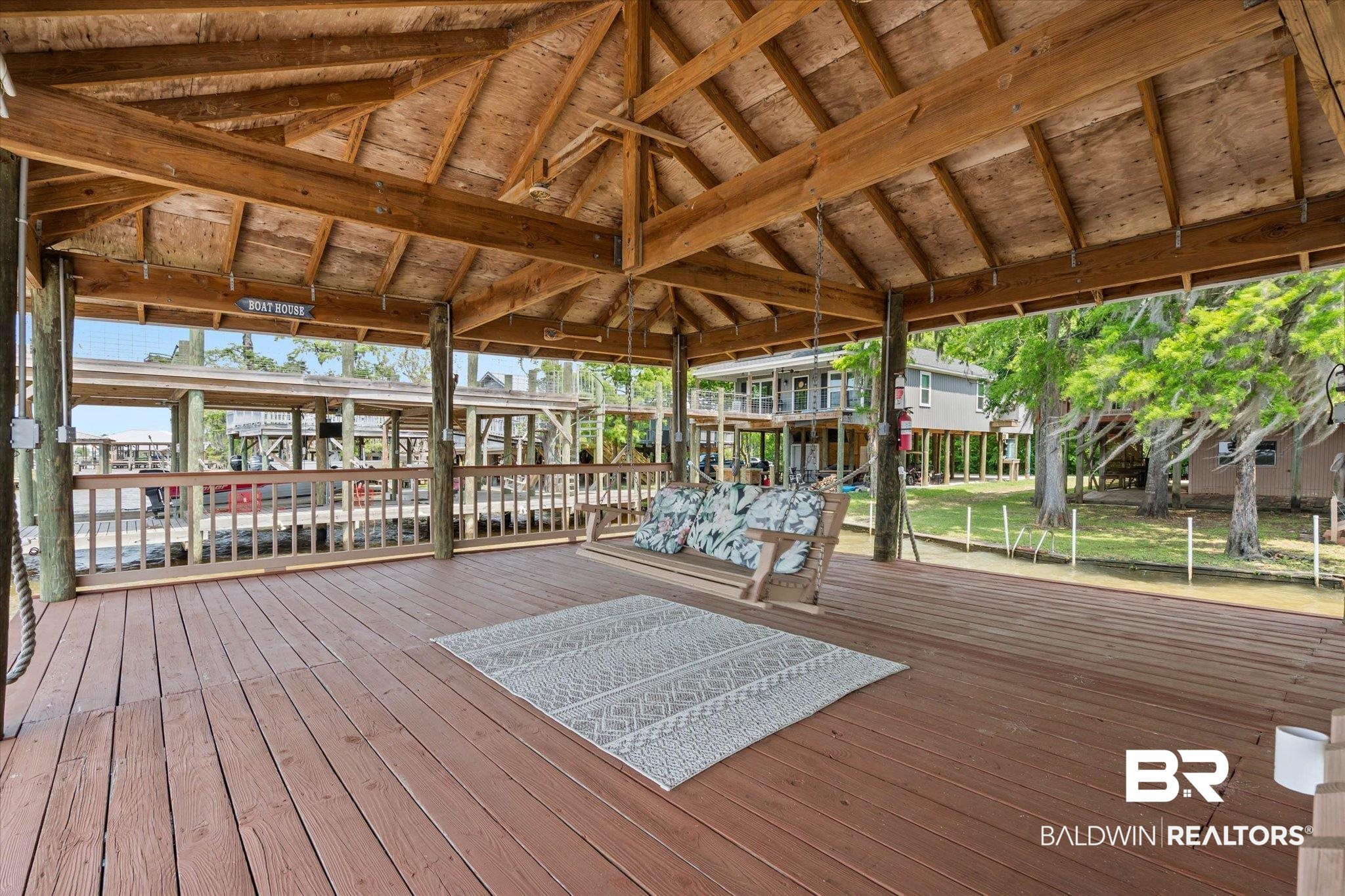 41923 Bayou Road Bay Minette, AL 36507 - Photo 27 of 35 Covered outdoor deck space featuring wood-finish decking and a natural wood-finish ceiling