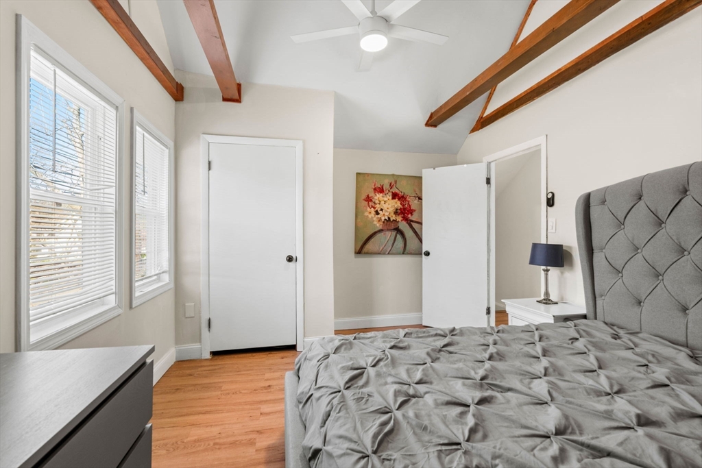 271 Broadway Haverhill, MA 01832 - Photo 27 of 41 a view of a bedroom with wooden floor and a window