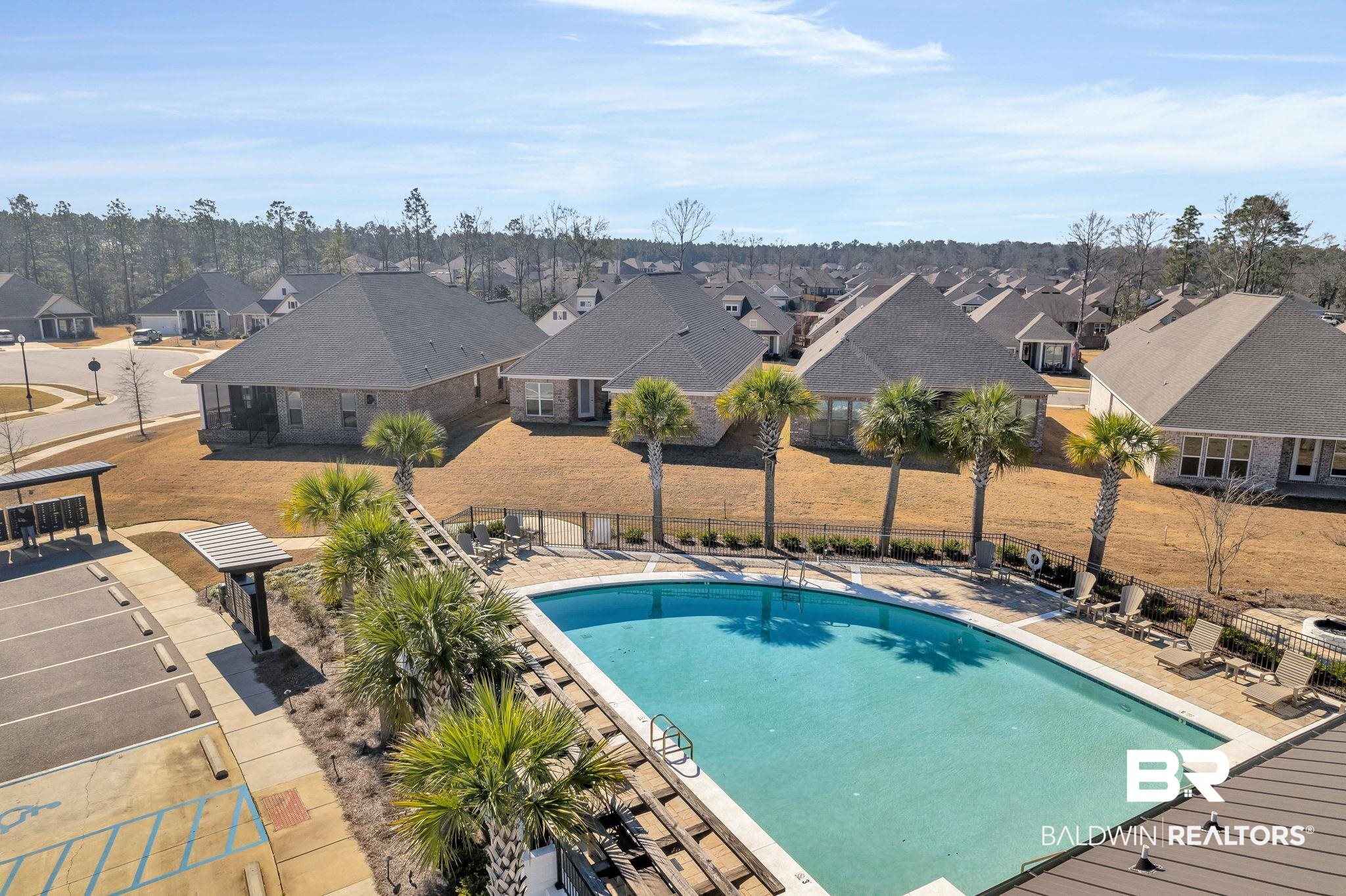31654 Canopy Loop Daphne, AL 36527 - Photo 62 of 64 Community pool featuring a patio area and a residential view