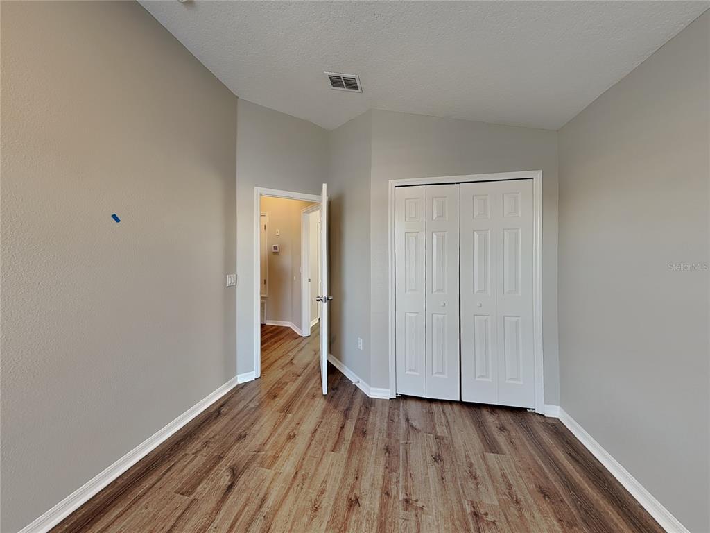 Undisclosed Address Land O' Lakes, FL 34639 - Photo 18 of 25 a view of a room with wooden floor