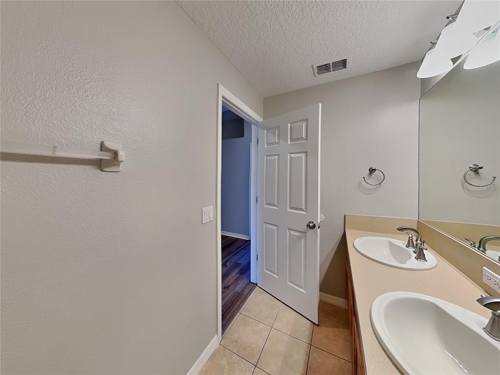 Undisclosed Address Land O' Lakes, FL 34639 - Photo 24 of 25 a bathroom with a sink toilet and shower