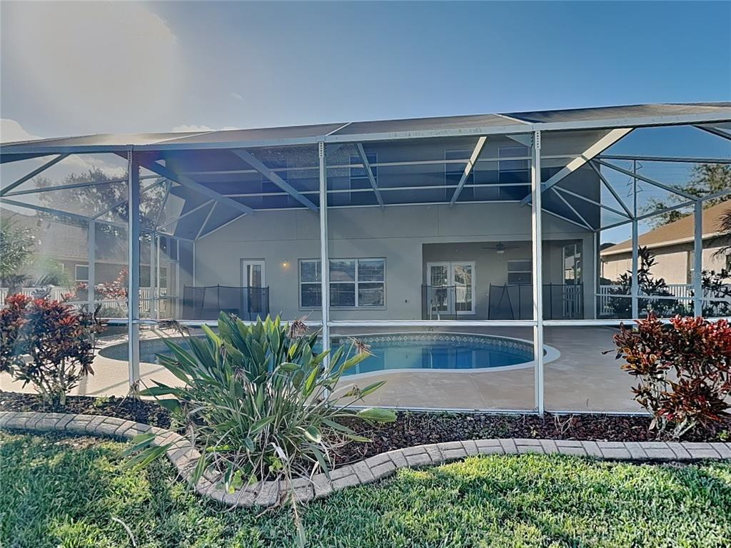 Undisclosed Address Land O' Lakes, FL 34639 - Photo 25 of 25 front view of a house with a garden