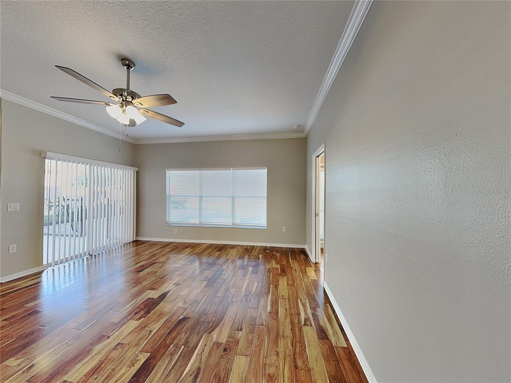 Undisclosed Address Land O' Lakes, FL 34639 - Photo 4 of 25 wooden floor in an empty room with a window