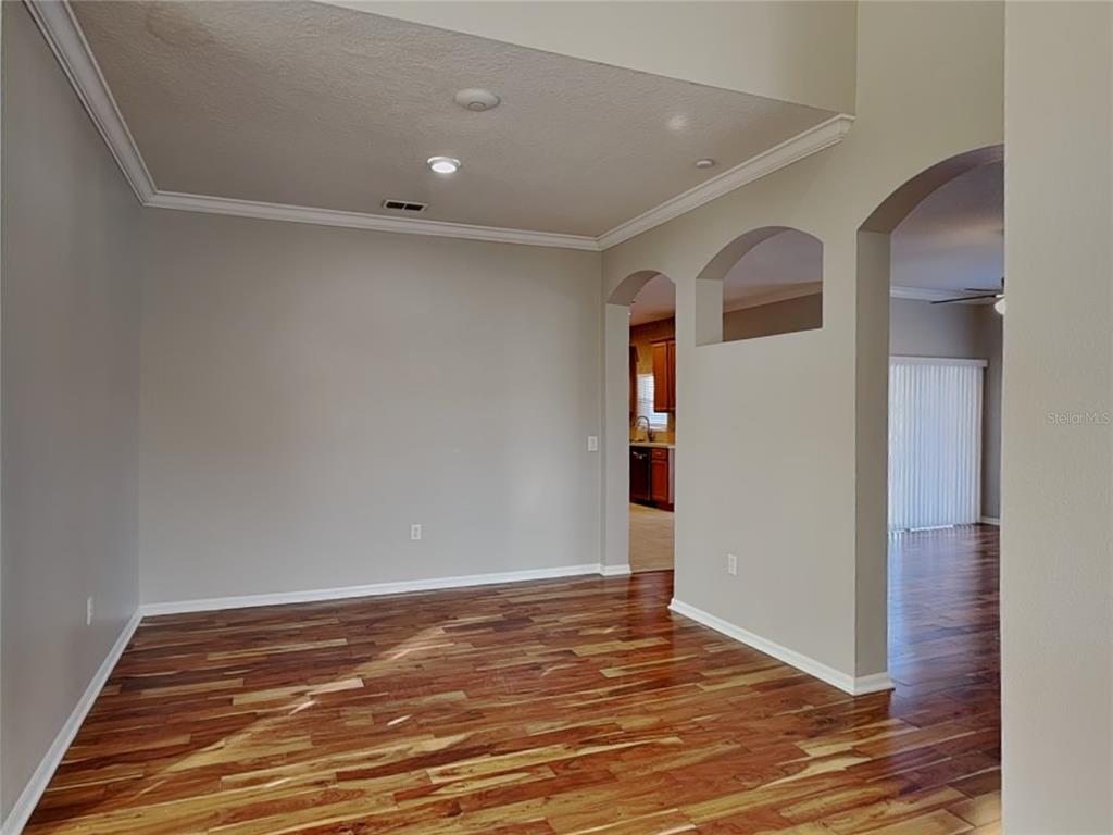 Undisclosed Address Land O' Lakes, FL 34639 - Photo 8 of 25 a view of a livingroom with wooden floor