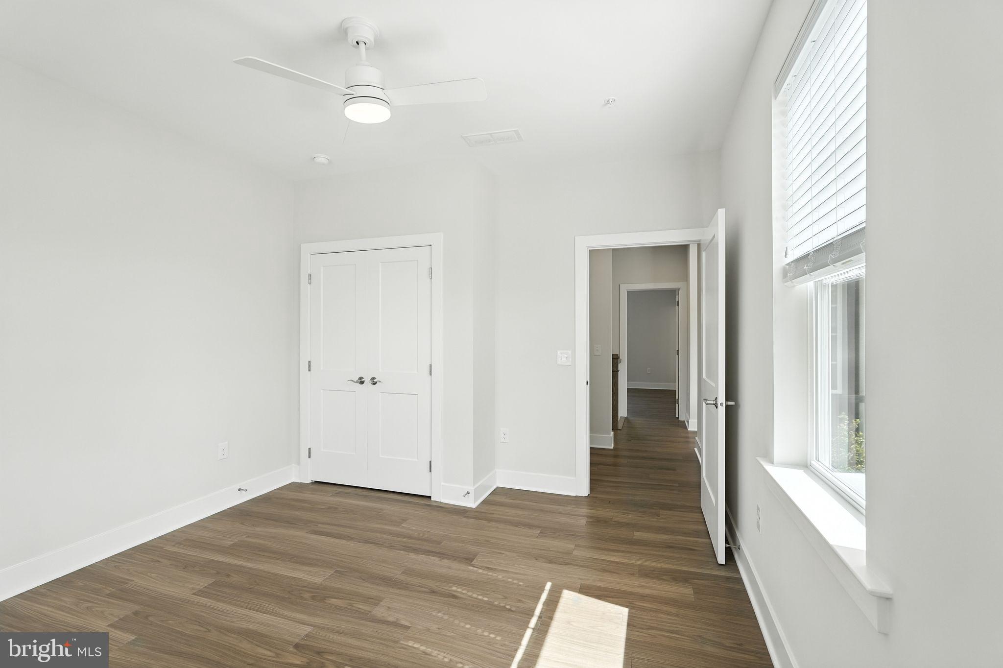 17 Mainland Road, Unit 115 Harleysville, PA 19438 - Photo 13 of 15 a view of a room with wooden floor and windows