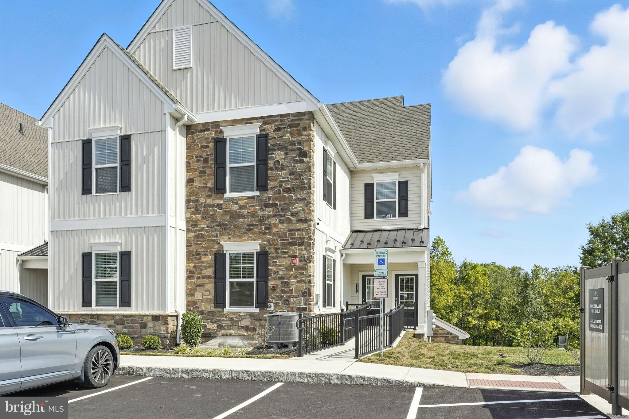 17 Mainland Road, Unit 115 Harleysville, PA 19438 - Photo 2 of 15 a front view of a house with a yard