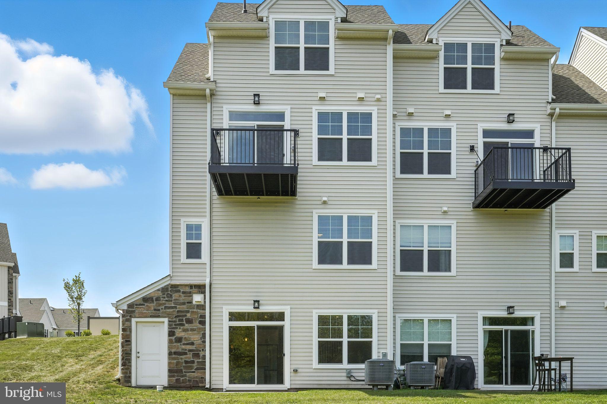 17 Mainland Road, Unit 115 Harleysville, PA 19438 - Photo 3 of 15 a front view of a house with a yard