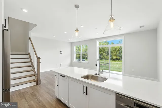 a kitchen with sink and window