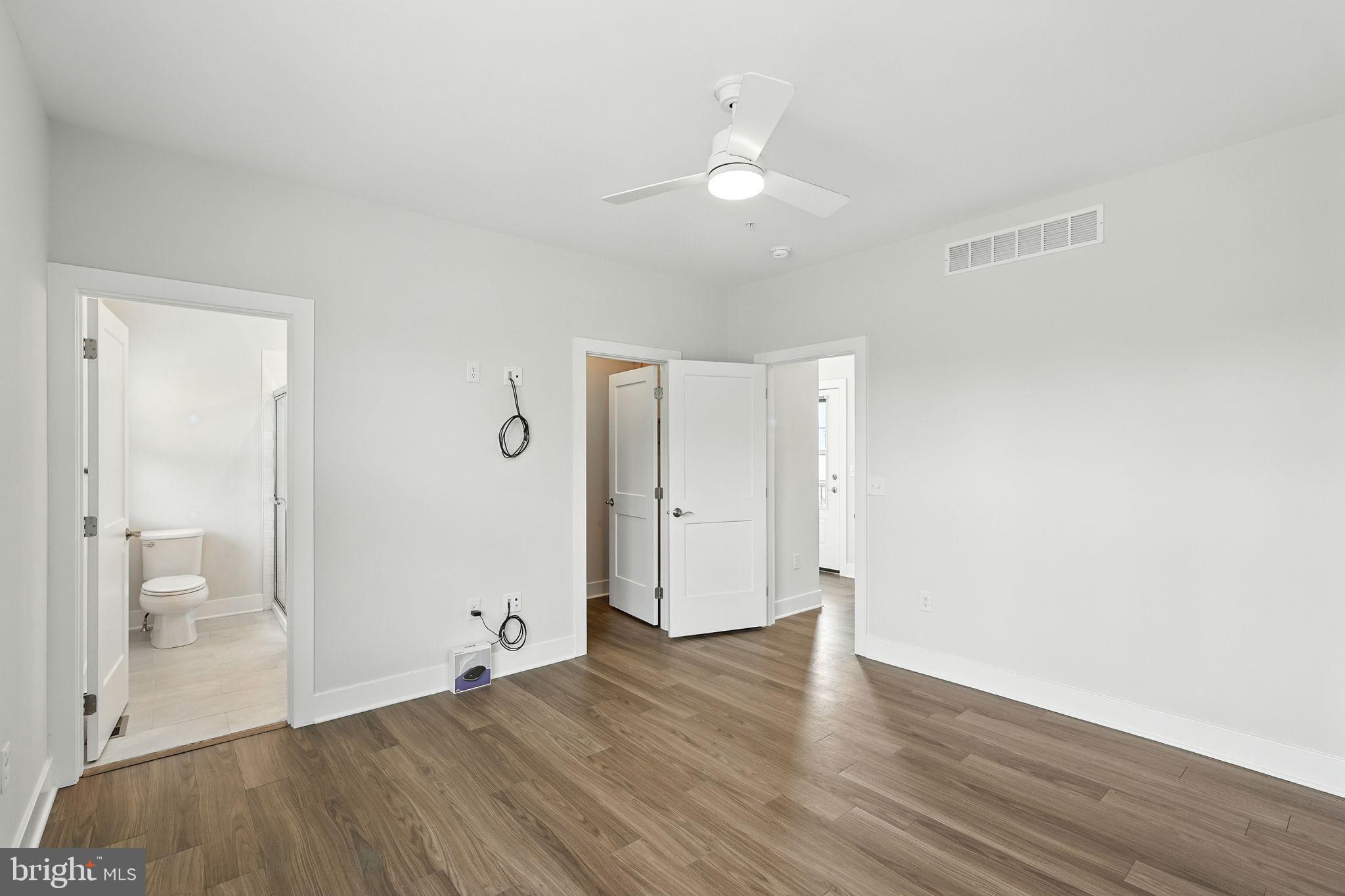 17 Mainland Road, Unit 115 Harleysville, PA 19438 - Photo 8 of 15 a view of an empty room and wooden floor