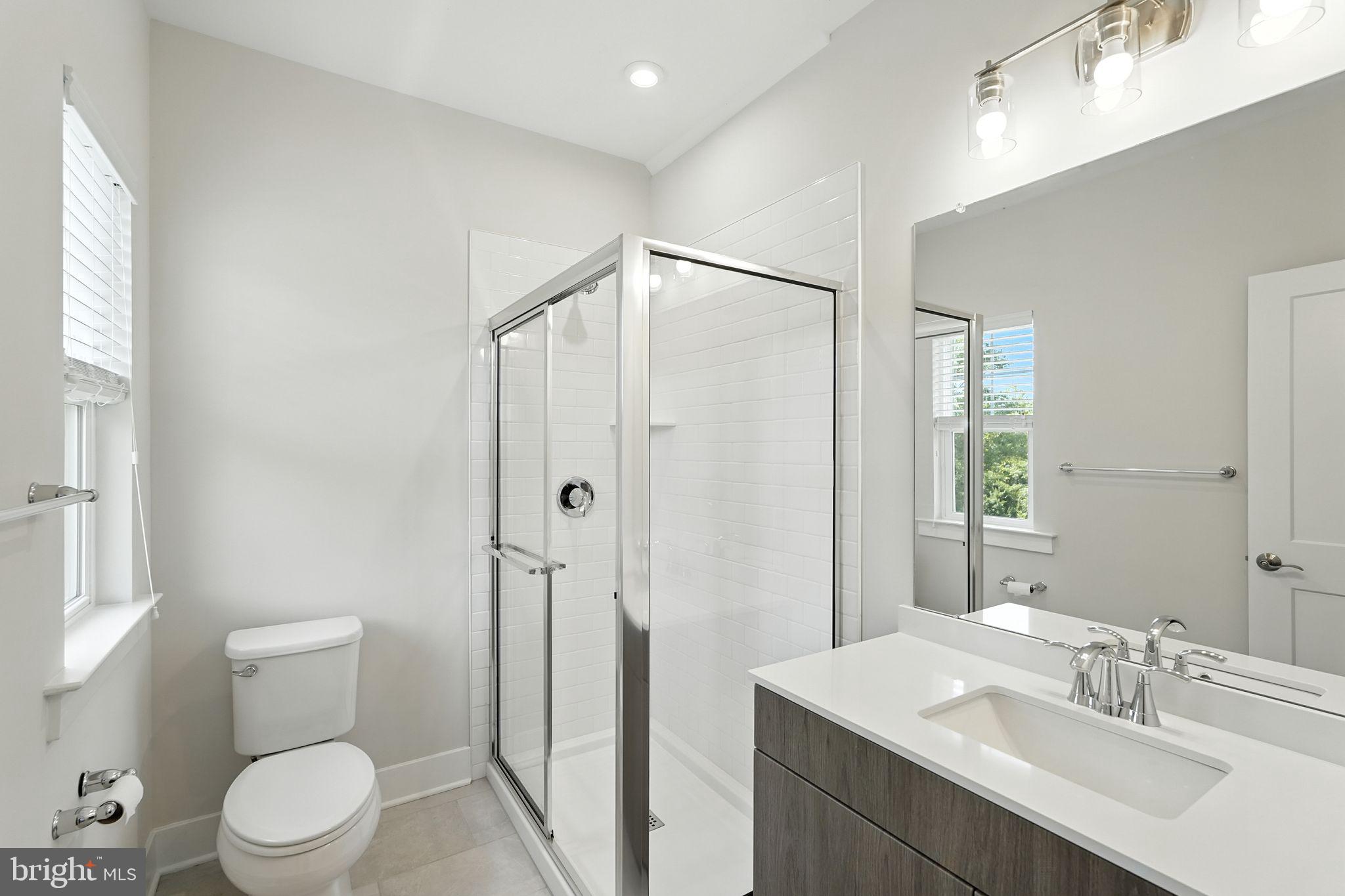 17 Mainland Road, Unit 115 Harleysville, PA 19438 - Photo 9 of 15 a bathroom with a sink toilet and shower