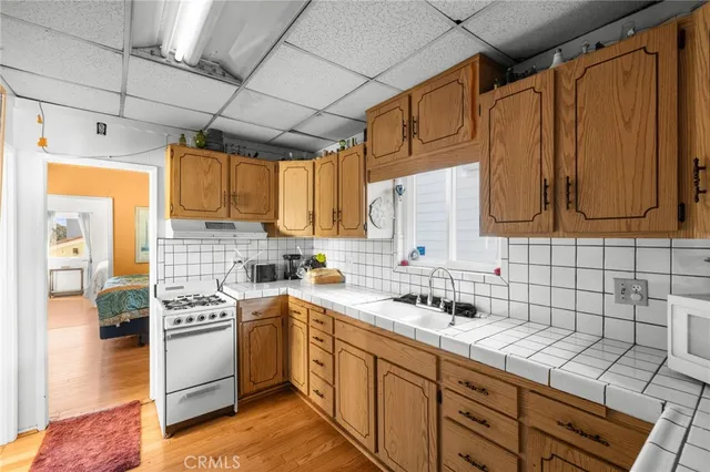 a kitchen with refrigerator cabinets and washer