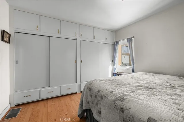 an aerial view of residential houses with outdoor space and parking