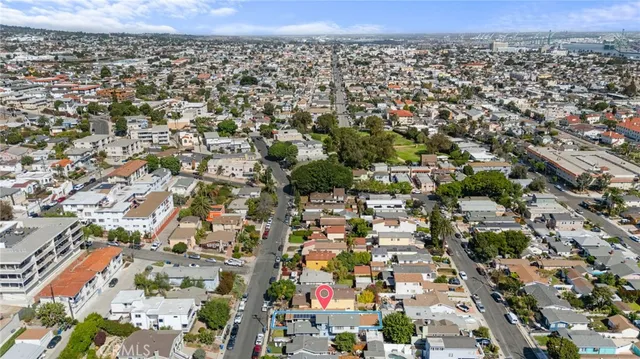 an aerial view of a house with a swimming pool
