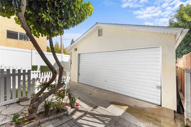 a front view of a house with outdoor seating