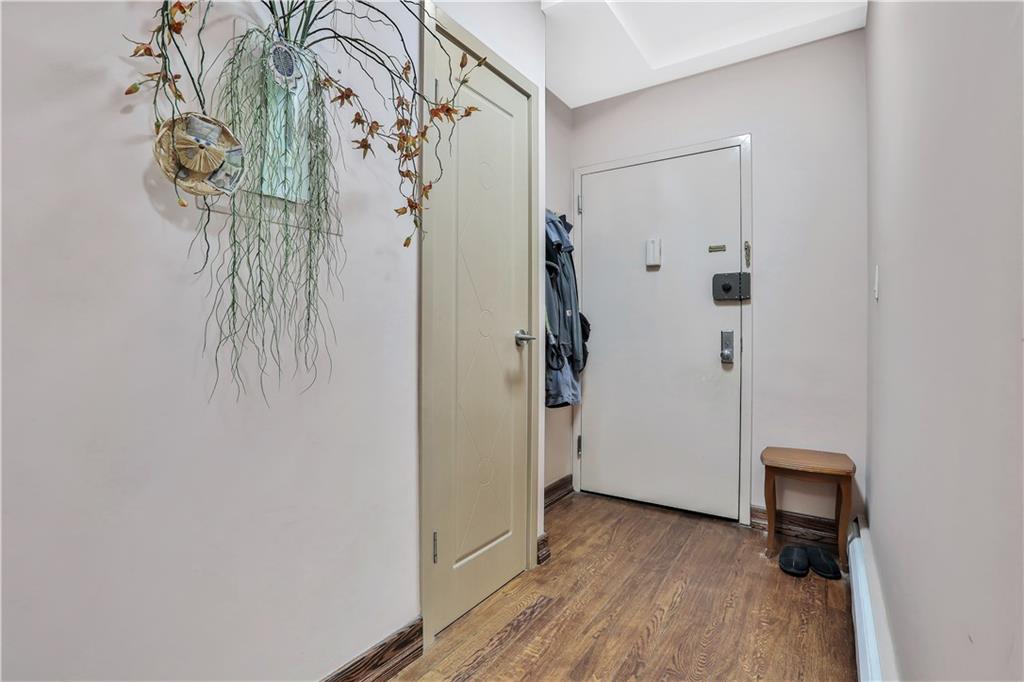 3392 Guider Avenue, Unit 8 Brooklyn, NY 11235 - Photo 11 of 22 a view of a room with wooden floor and a shower