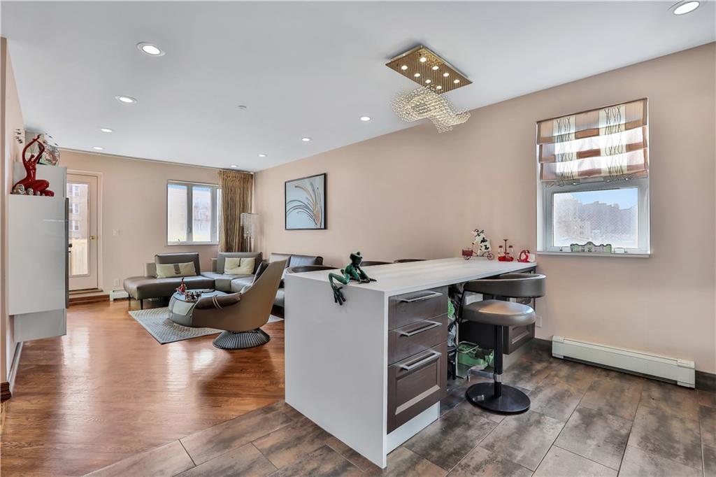 3392 Guider Avenue, Unit 8 Brooklyn, NY 11235 - Photo 20 of 22 a view of a livingroom with workspace and a window