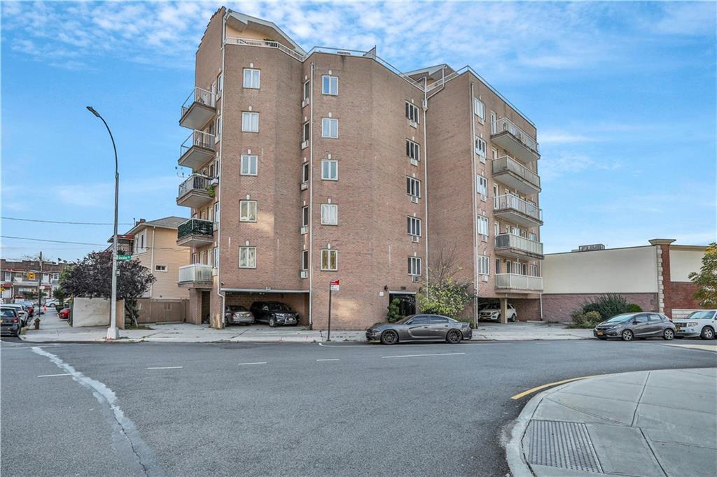 3392 Guider Avenue, Unit 8 Brooklyn, NY 11235 - Photo 22 of 22 a buildings with a lots of cars parked in front of it