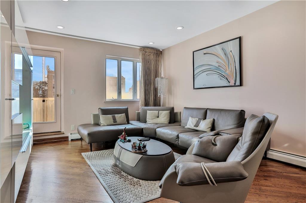 3392 Guider Avenue, Unit 8 Brooklyn, NY 11235 - Photo 5 of 22 a living room with furniture and wooden floor