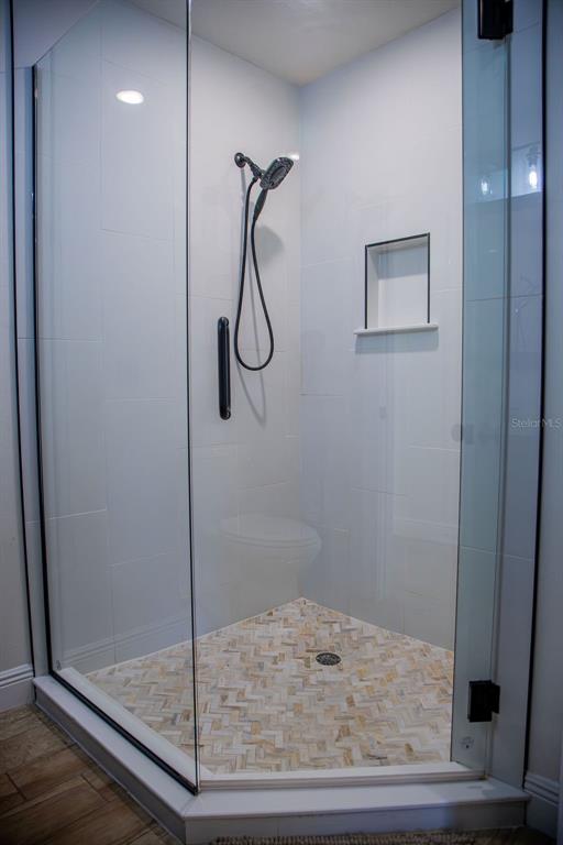 336 Lake Mabel Loop Road Lake Wales, FL 33898 - Photo 30 of 60 a bathroom with a shower