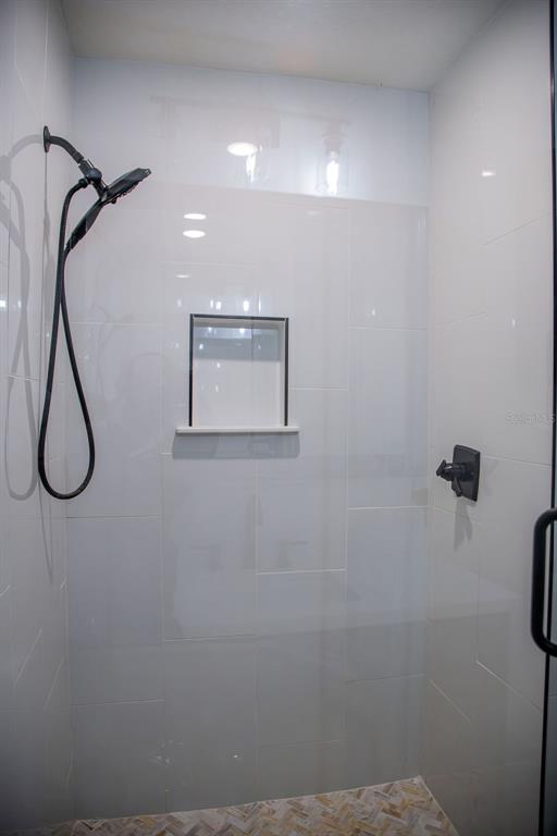 336 Lake Mabel Loop Road Lake Wales, FL 33898 - Photo 31 of 60 a bathroom with a shower