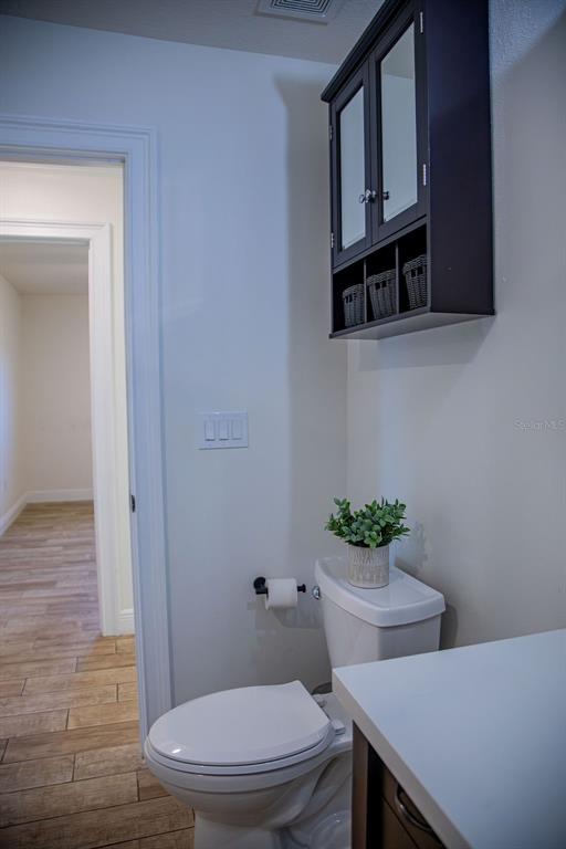 336 Lake Mabel Loop Road Lake Wales, FL 33898 - Photo 32 of 60 a white toilet sitting next to a bathroom sink