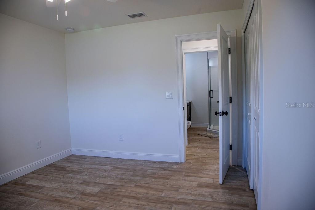 336 Lake Mabel Loop Road Lake Wales, FL 33898 - Photo 35 of 60 a view of a hallway with wooden floor