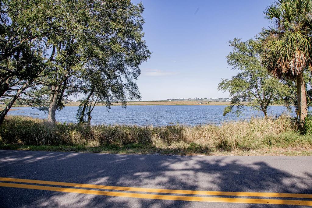 336 Lake Mabel Loop Road Lake Wales, FL 33898 - Photo 52 of 60 a view of a yard with wooden fence